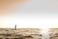 yolo-board-woman-paddling-sup-in-ocean-at-sunset.jpg